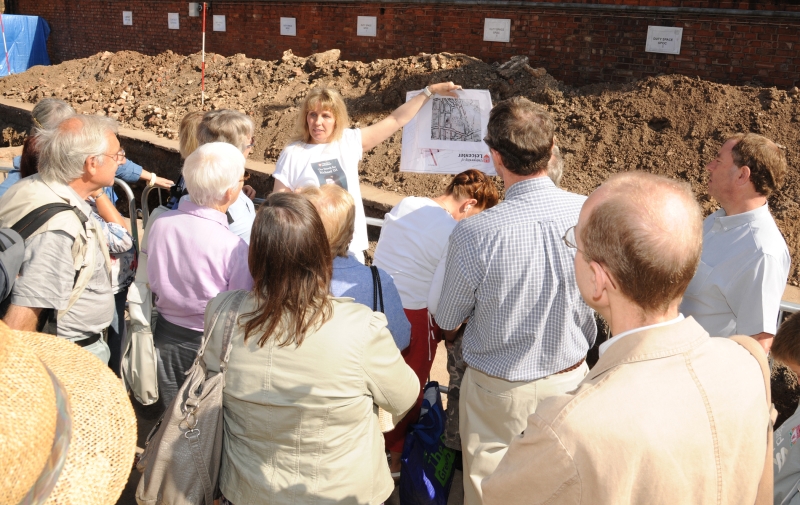 Philippa Langley (Richard III Society) showing a group of visitors around the site at the public open day (Credit - University of Leicester)